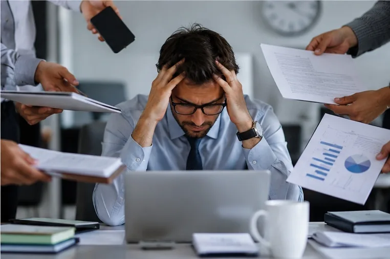 Manager under pressure from competing workplace demands